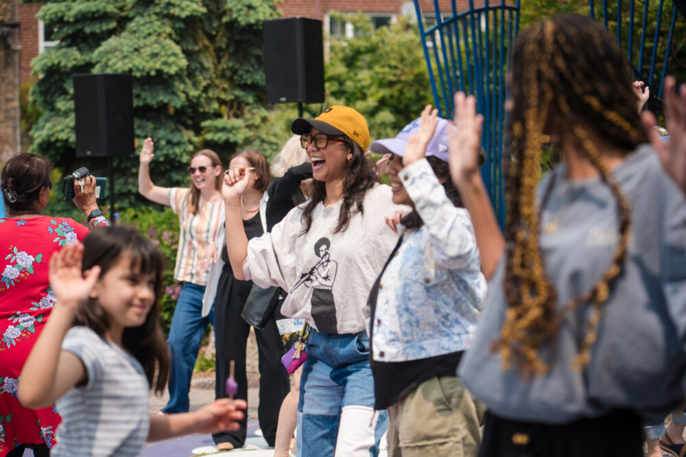 People dance in a public park.