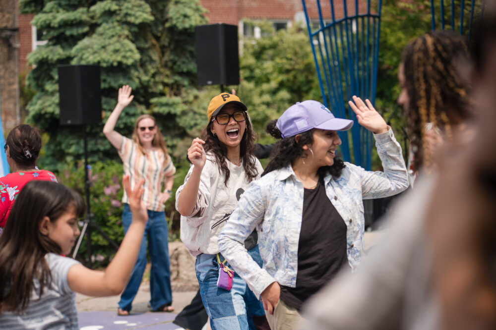 People dance at an Arts in the Parks Event.